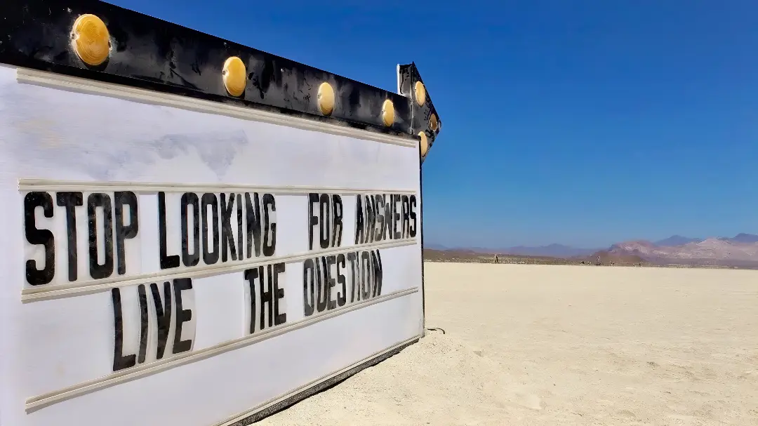 Desert sign: "Stop looking for answers.