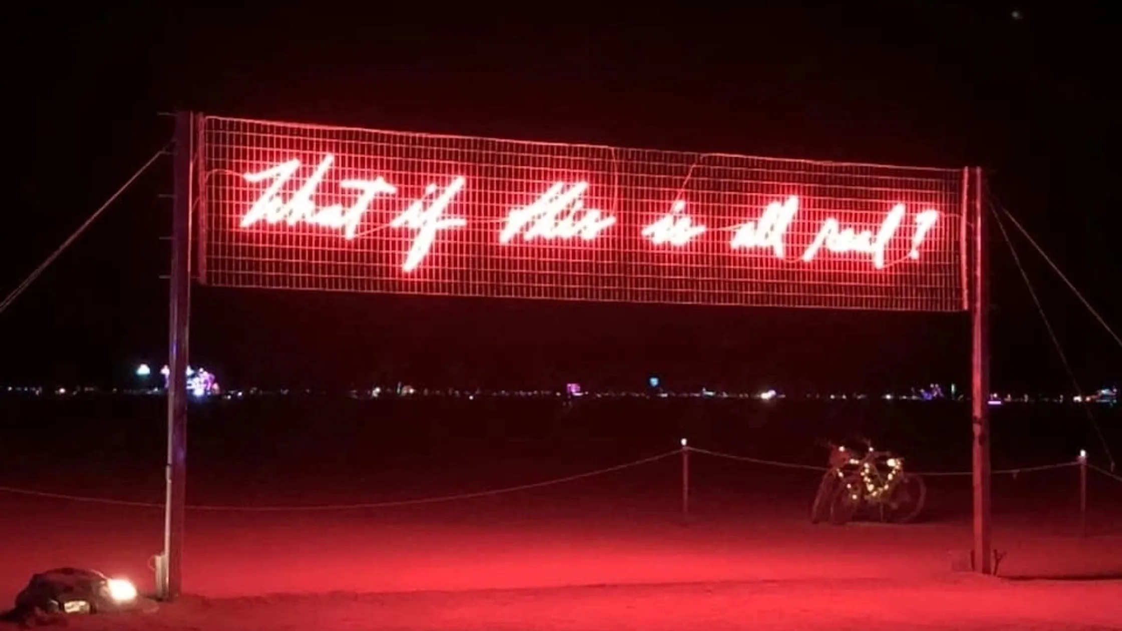 Neon sign reads "What if this is all real?